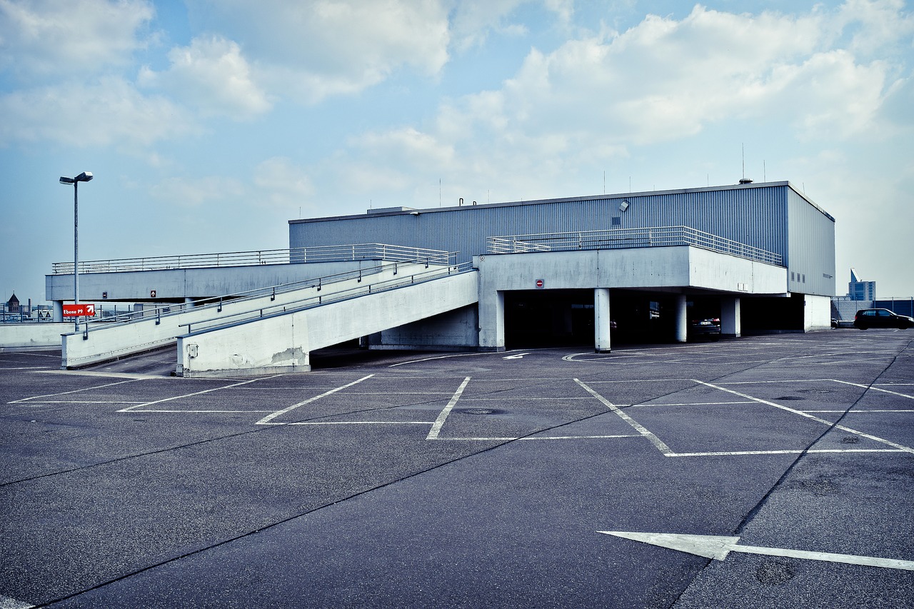 A wide angle picture of a parking garage from outside