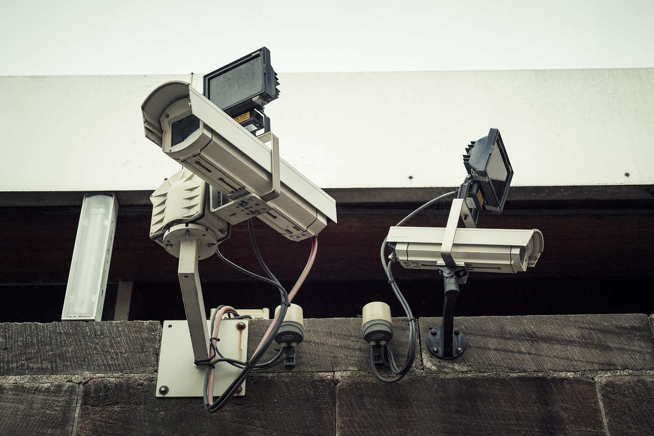 Two security cameras on a wall