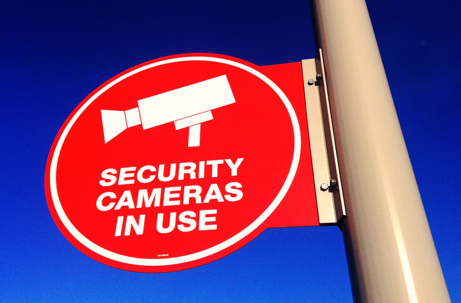 Outdoor sign notifying Security Cameras in Use